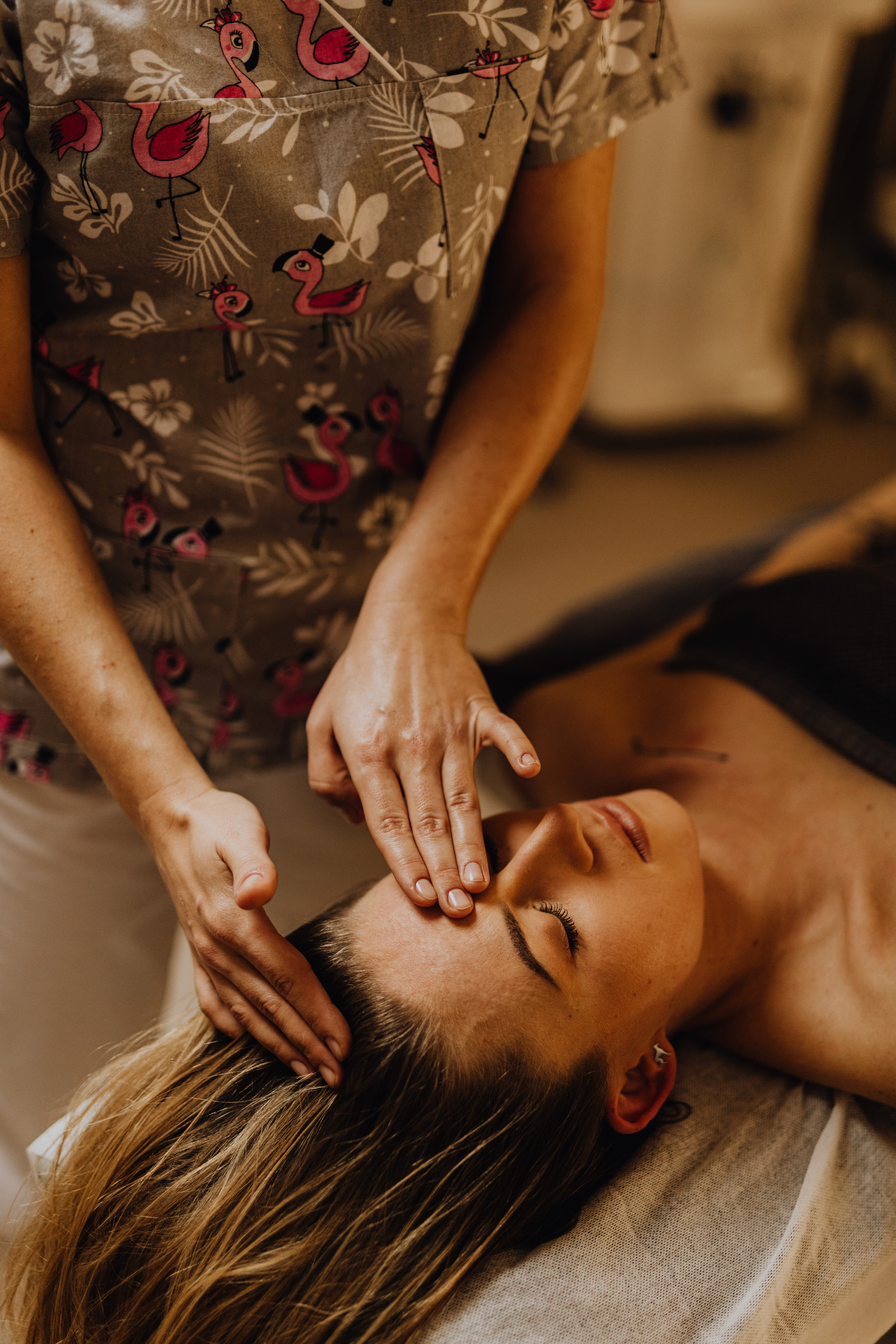 A Masseuse Doing a Head Massage